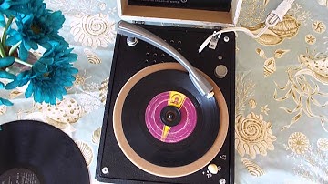 Decca manual 3 speed playing a record