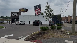 Flock Camera Removed Sign Reading No Flock Zone Up Outside Cannabis Dispensary in Michigan