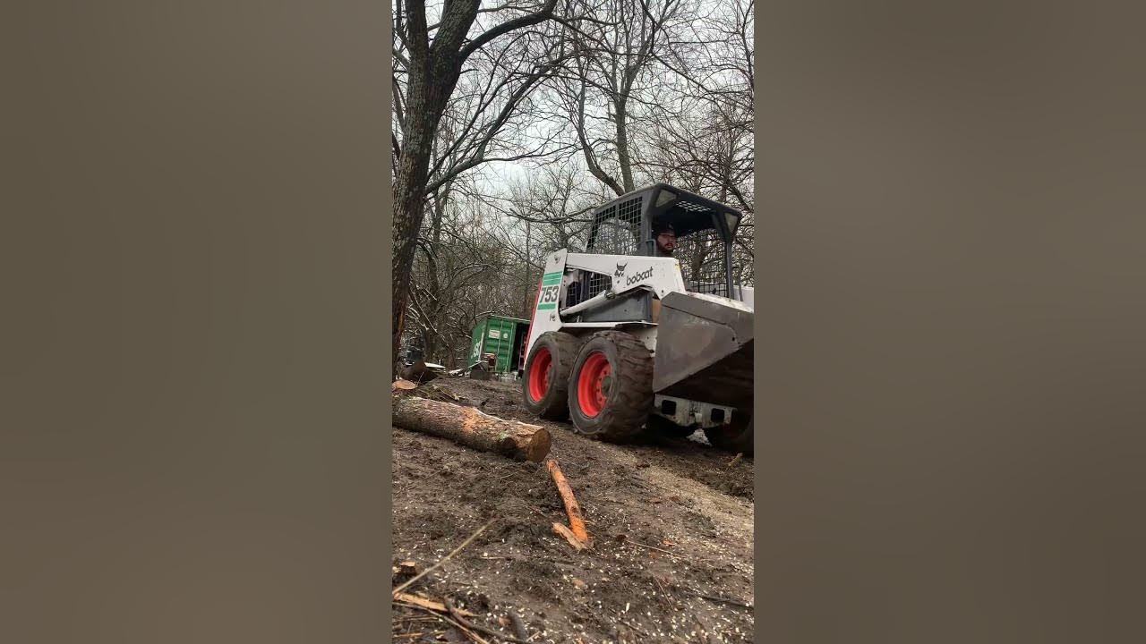 Bobcat 753 helping to move firewood in the mud! YouTube