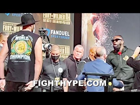 (2ND ANGLE) TYSON FURY HEATED VERBAL EXCHANGE WITH DEONTAY WILDER & HIS TEAM DURING WEIGH-IN