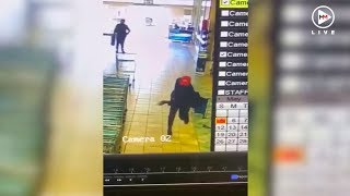 Security guard hailed as hero after shooting at armed robbers