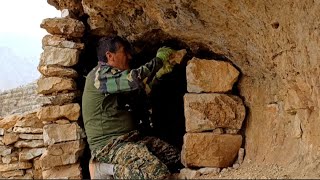 Building a stone shelter with a fireplace before it rains | Survival in nature