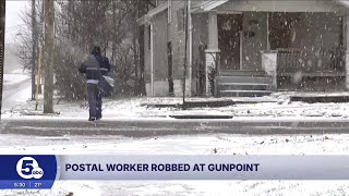 Postal worker robbed at gunpoint