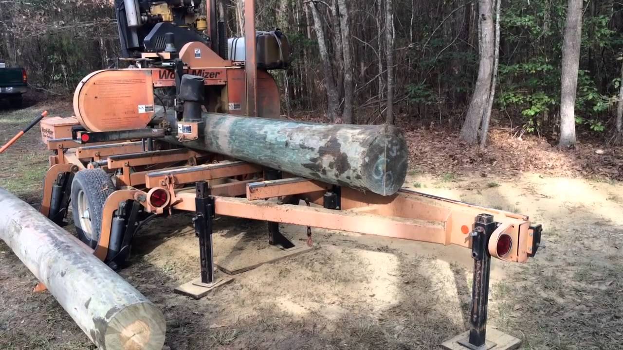 Wood mizer cutting telephone poles YouTube