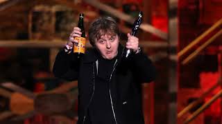 Lewis Capaldi swigs bottle of Buckfast after winning Brits Song of the Year prize