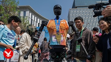 Robots compete against humans for first time in half marathon