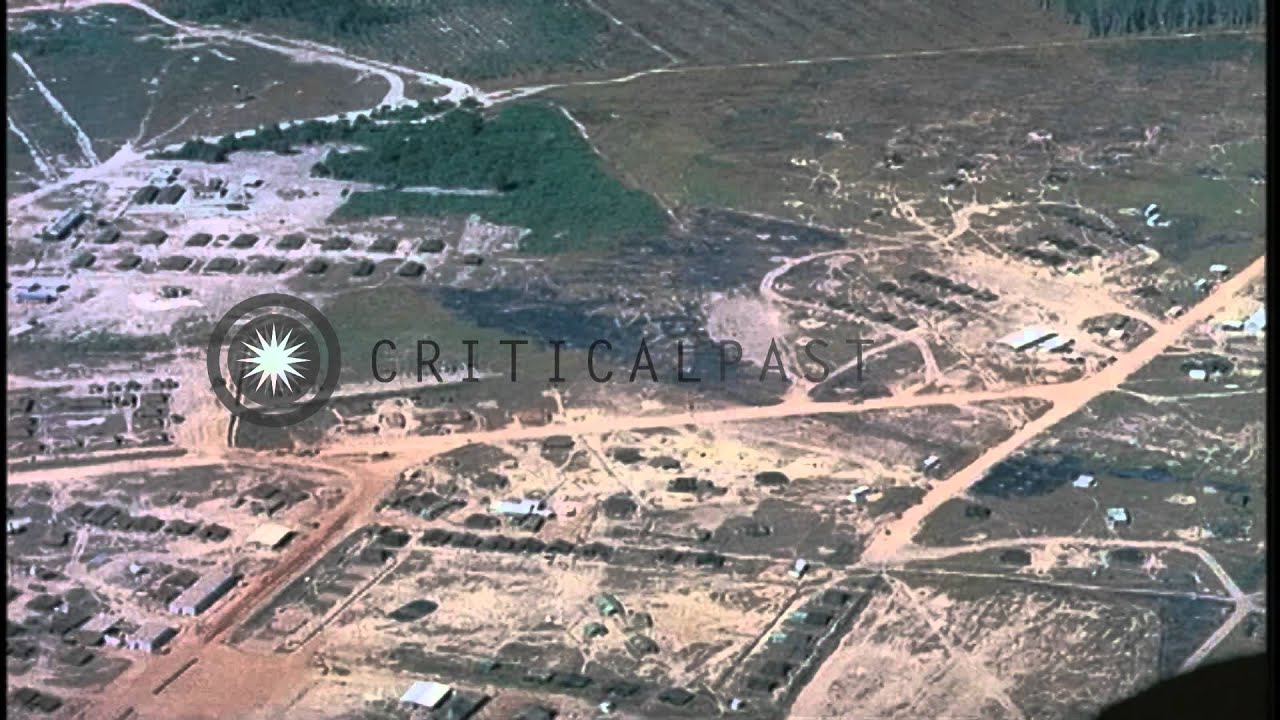 Aerial view of the Bien Hoa Air Base  and soldiers move 