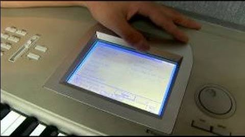 How to Play a Korg Triton Studio Keyboard : Korg Triton Studio Keyboard Disk Button