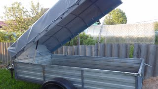 :    . Hinged COVER FOR TRAILER. Do-it-yourself trailer upgrade