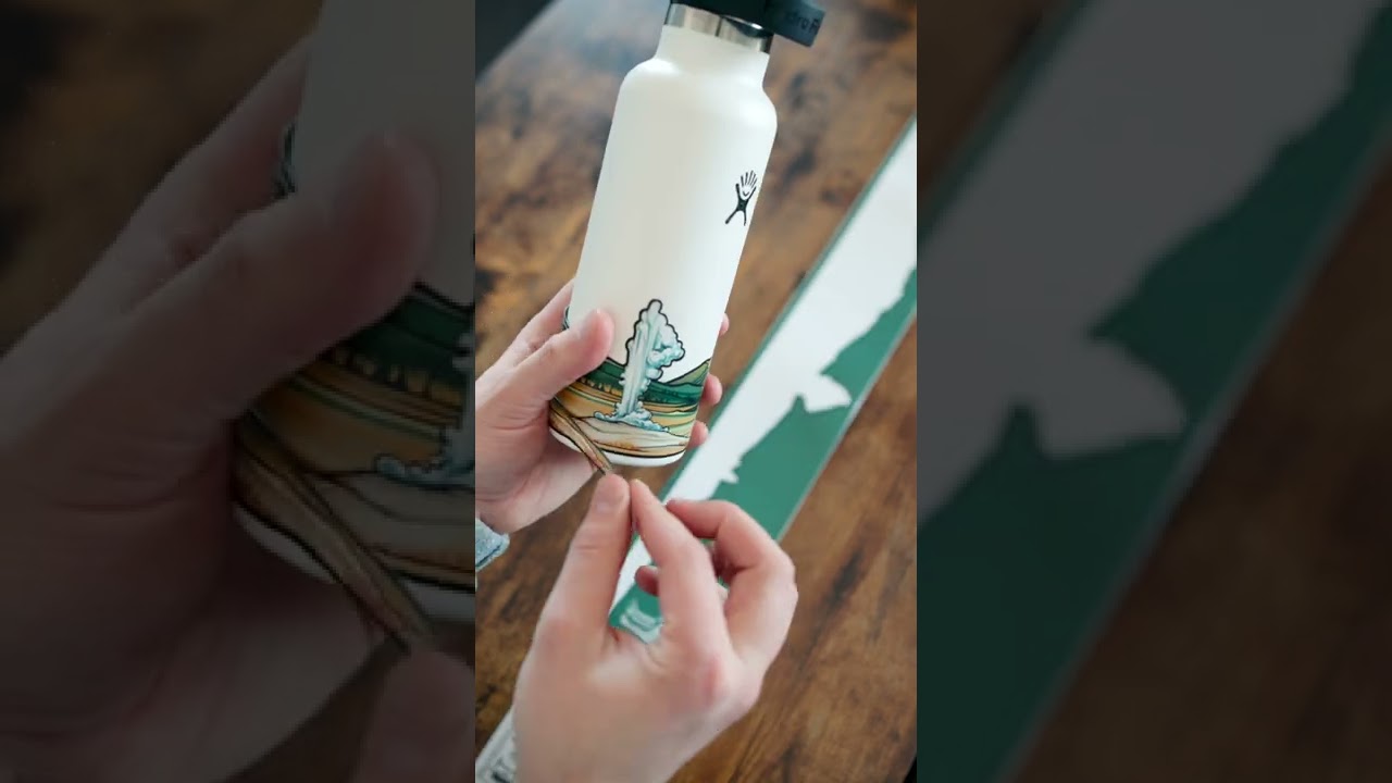 Wrapping a Yellowstone National Park Infinity Sticker around a Hydro Flask 