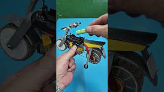 Homemade motorbike with auxiliary wheels