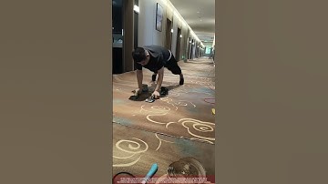 Installer Knees Carpet Power Stretcher Tightening a Seam