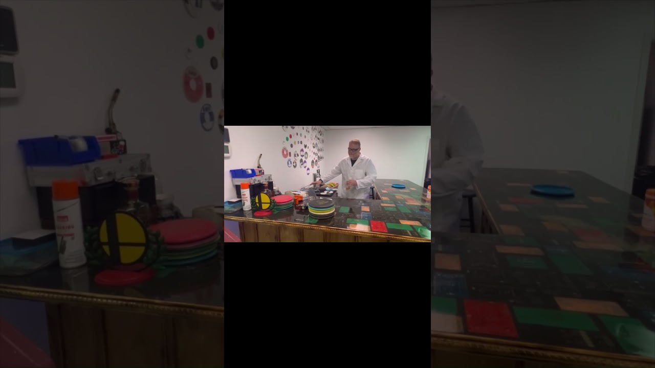 Chemist Dan wrestles with gas cylinders in the lab