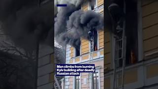Man climbs from burning Kyiv building after deadly Russian attack #shorts