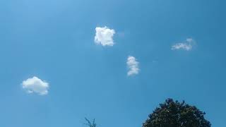 Shadow being cast off low cloud. Aginst a blue sky.