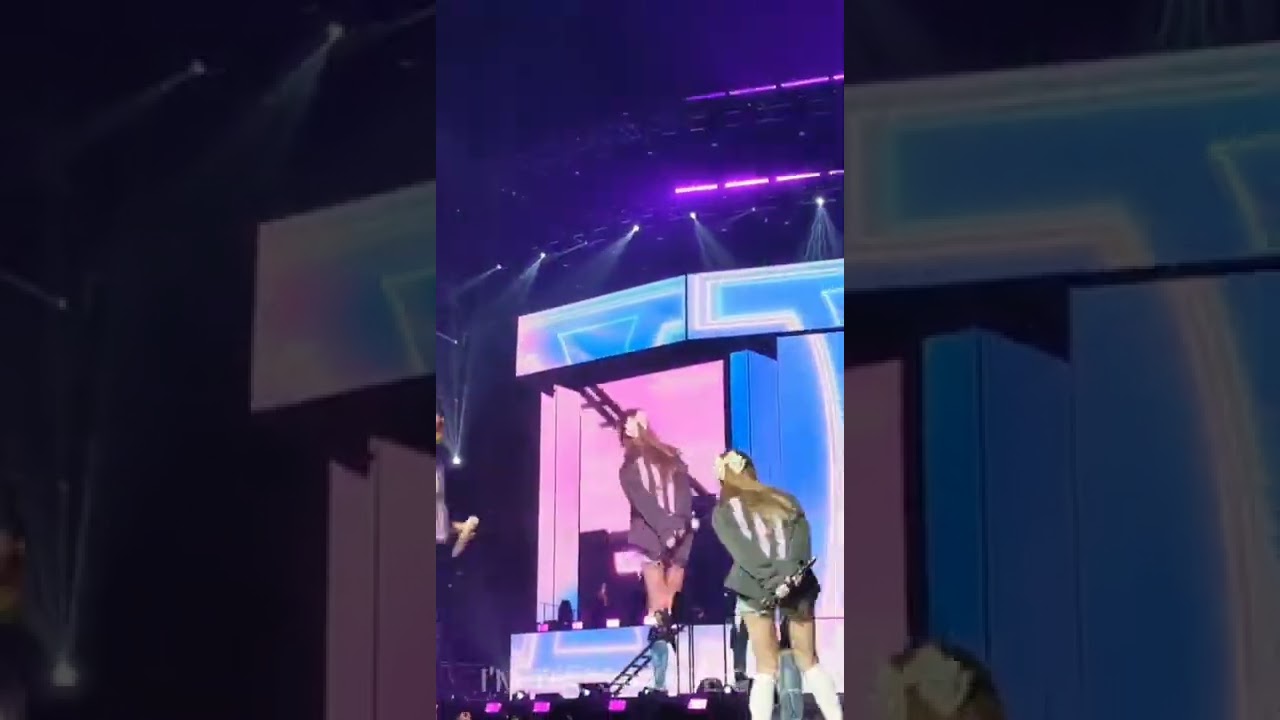 sana and jihyo playfully kicking each others butt 