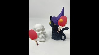 When a skull and a black cat team up for a game of ping pong... 🎃🐾