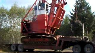 UNLOADING HUGE MADILL 044 GRAPPLE YARDER, JUSKATLA, BC