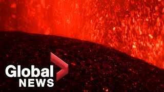 Eruptions from Italy's Mount Etna light up night sky