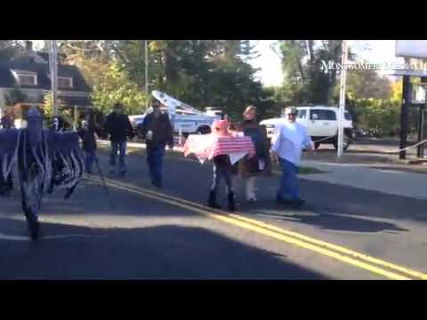 The Council Rock High School North Marching Band leads the Newtown Halloween Parade.