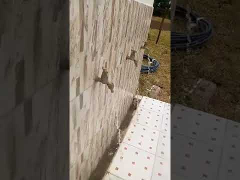 Msaje Water Project - COMPLETED - Far to close, man using water
