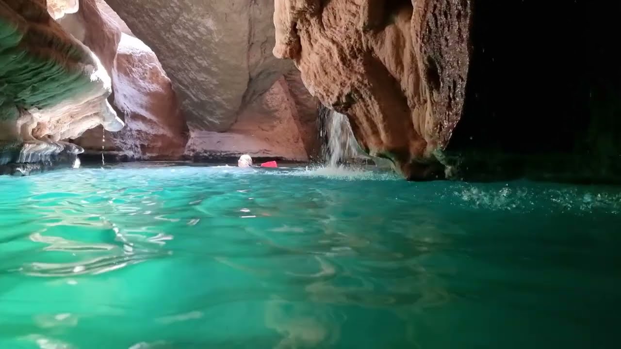 Swimming in the amazing Wadi Shab cave, Oman