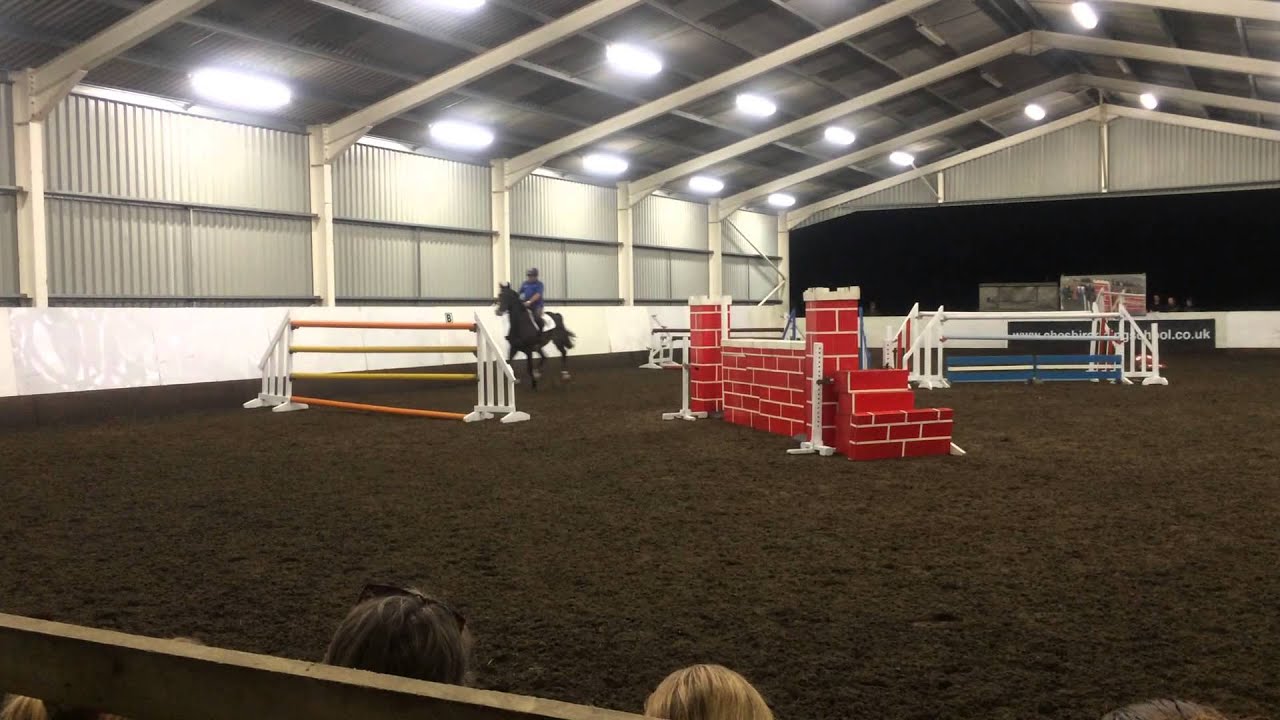 Cheshire riding school, watching Geoff Billington jump the top of the