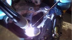 BMW e30 front suspension knuckle hub carrier modification for 4 pot calipers.
