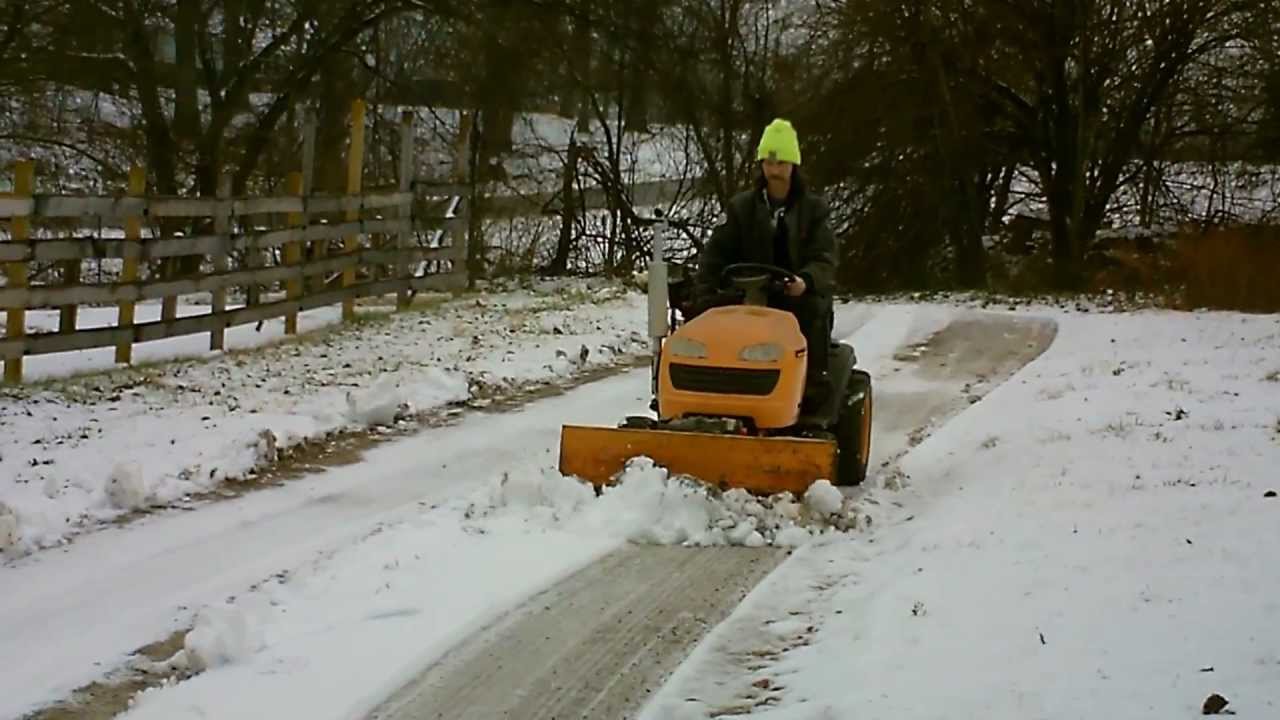 Garden tractor plowing snow with blade YouTube