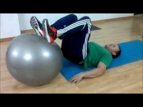Curl femoral tumbado con fitball Curl femoral tumbado con fitball