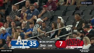 ref goes into the crowd to tell the band to stop playing