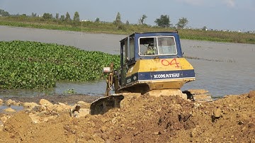 Three Stronger KOMATSU Bulldozers Operator Removing Soils Vs Extreme Unloading Soils Dump Track