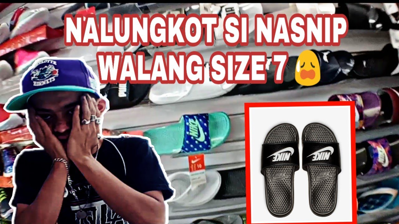 burgundy nike flip flops with gold check