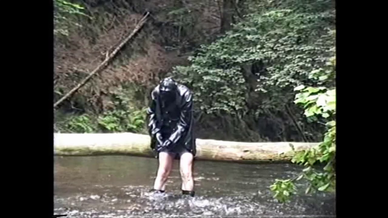 Latex Jacket and Latex Mask on a trunk in the river
