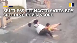Selfless teenager in China saves boy speeding down slope
