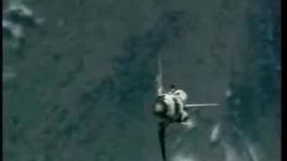 STS-114 Discovery back-flip in front of the ISS