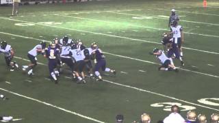Warren Easton's Kevin Alexis destroys pulling guard and makes the tackle vs Holy Cross