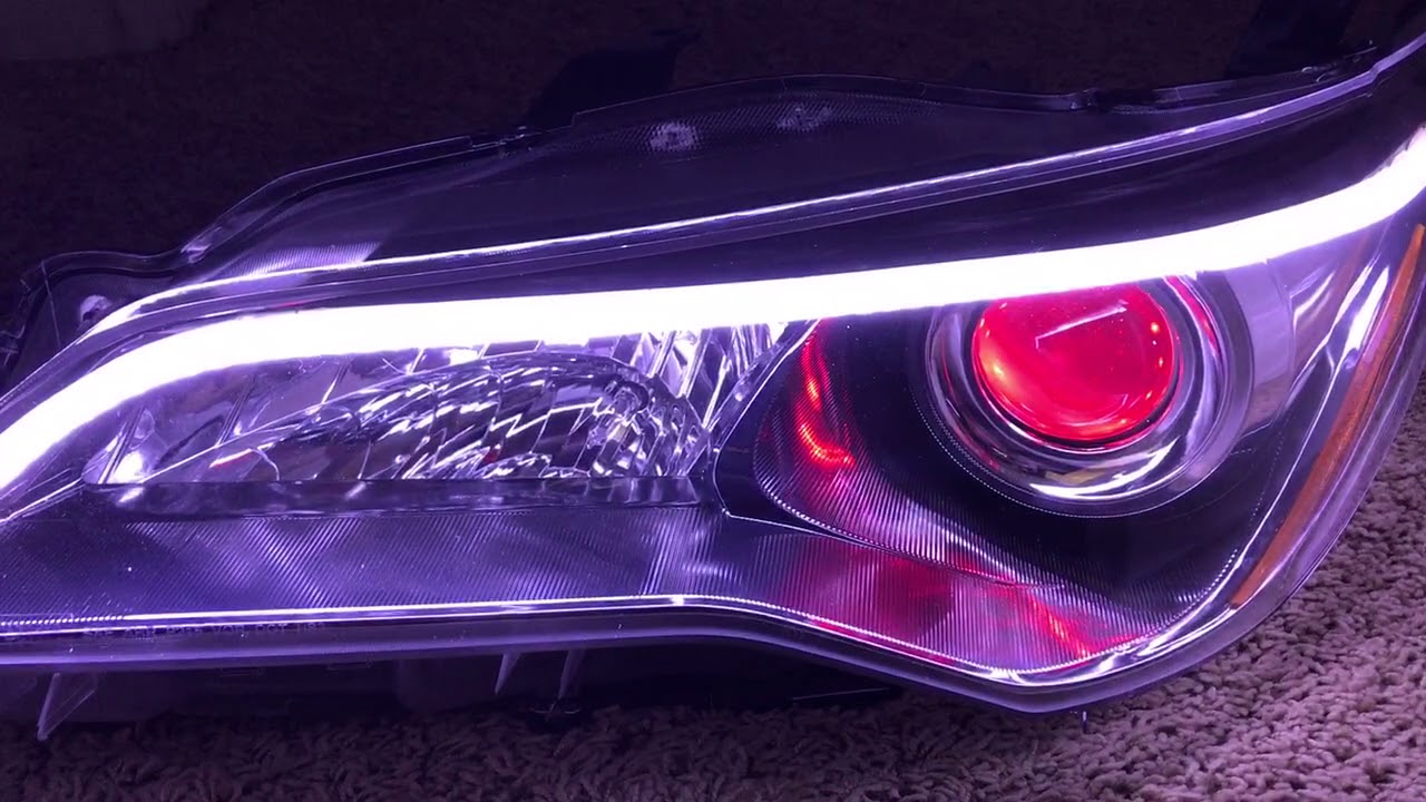 2015 - 2017 Toyota Camry headlights retrofitted with RGB demon eyes and DRL Switchback led strip