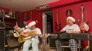 Madeline (lead guitar), Emily (percussion), and John (rhythm guitar) play “Silent Night !!