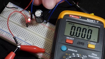 Electronics series resistor LED and capacitor circuit changing voltages multimeter measured