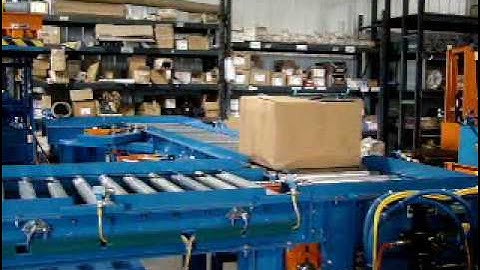 Omni Metalcraft Corp. Motor Driven Roller Conveyor with Chain Transfer and Crowder