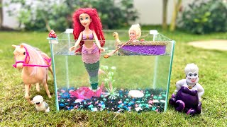 Ariel/ The Little Mermaid is trapped in a fish tank by Ursula’s twin sister. Sebastian helps her.