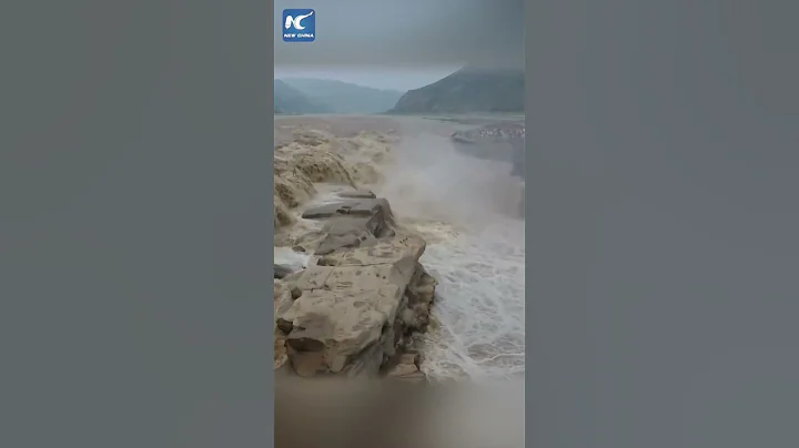 Turbulent water streams cascade down Hukou Waterfall in China