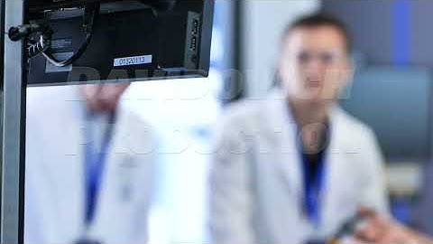 Medical professional attending a conference focusing on technology and scientific development