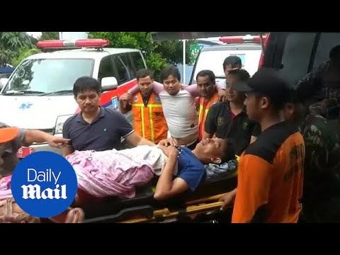 Teams rescue victims after devastating tsunami strikes in Indonesia