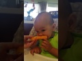 Ba Noi feeding Caleb mango seed