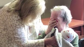 Two women give Alzheimer's patients baby dolls to comfort them