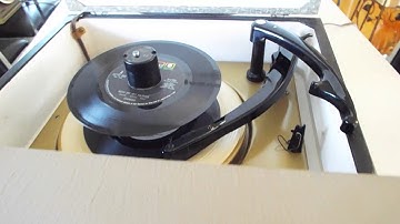 Magnavox 4 speed record player playing a stack of 45