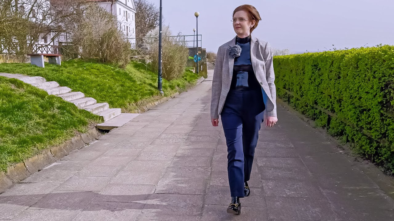 Sunny walk in classic suit over latex catsuit