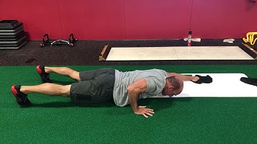 EricCressey.com: Slideboard Bodysaw Push-up w/Opposite Leg Reach